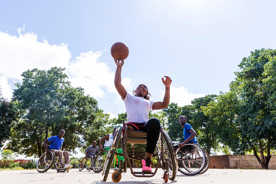 African Wheelchair Basketball Players on the Community Ground Playing a Friendly Match Photograph by GCShutter