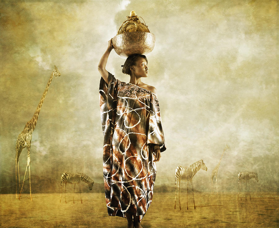 African woman holding bowl on head Photograph by Colin Anderson Productions pty ltd