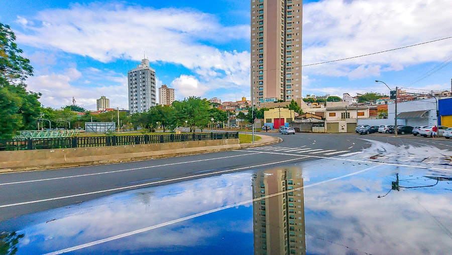 After the rain the reflection reveals the beauty of the city. Photograph by CRMacedonio