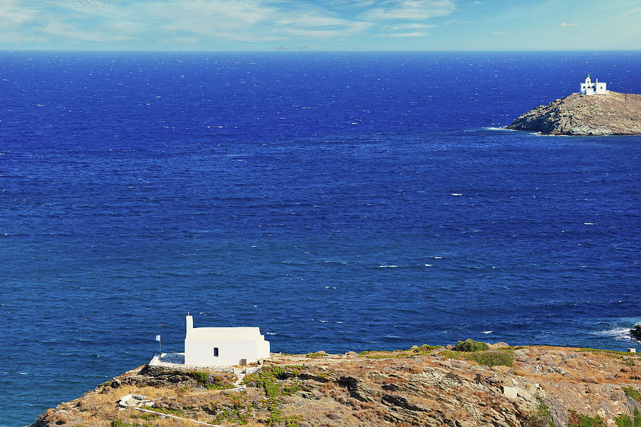 Agios Georgios church and the lighthouse at the port of Korissia ...