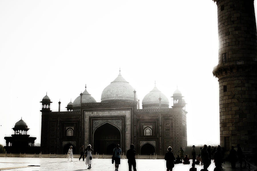 Agra, India - Mystic shot of Tajmahals Entrance gate made of red stone brick behind tourists Photograph by Arpan Bhatia