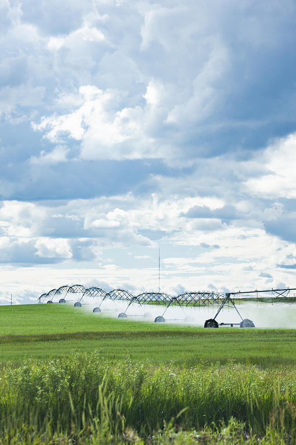 Agricultural Sprinklers Watering a Field in Rural Alberta, Canada Photograph by Powerofforever