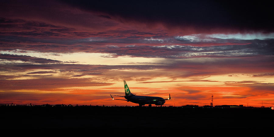 Airplane Departure at Dusk Photograph by Angelo DeVal