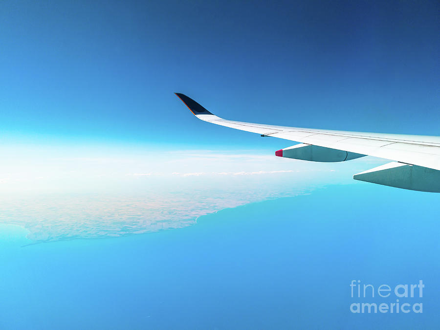 Airplane In Clear Blue Sky Photograph by Benny Marty