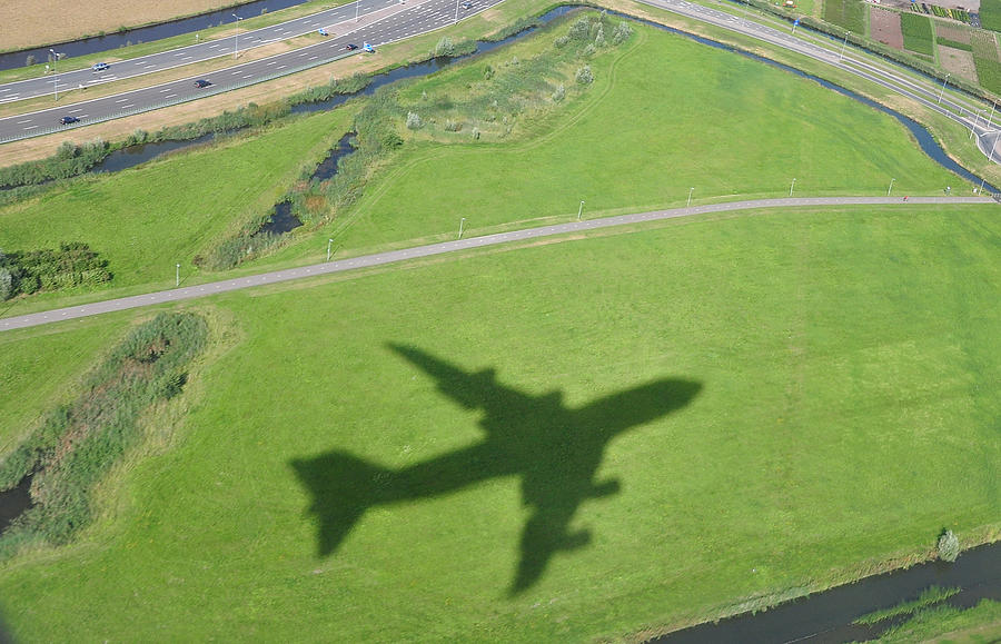 Airplane shadow Photograph by Powerfocusfotografie