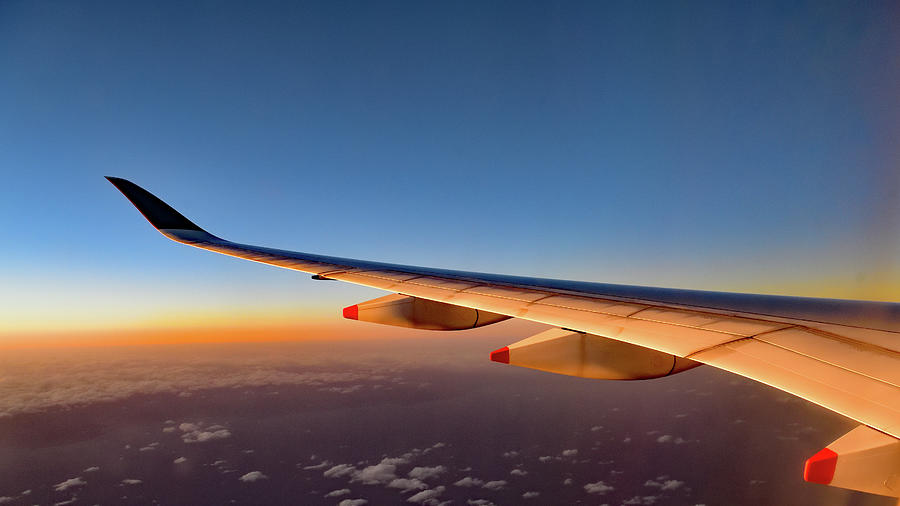 Airplane Wings during Golden Hour Flight Photograph by Amazing Action Photo Video