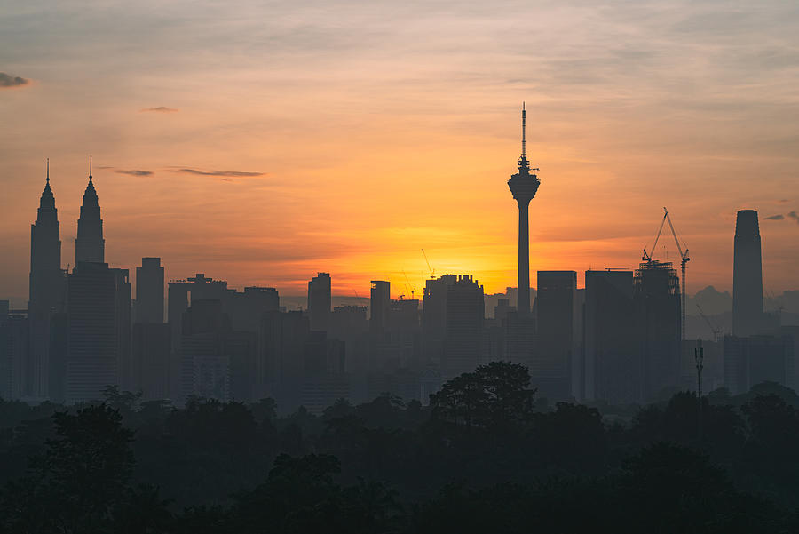 ajestic sunrise over downtown Kuala Lumpur, a capital of Malaysia. Photograph by Shaifulzamri