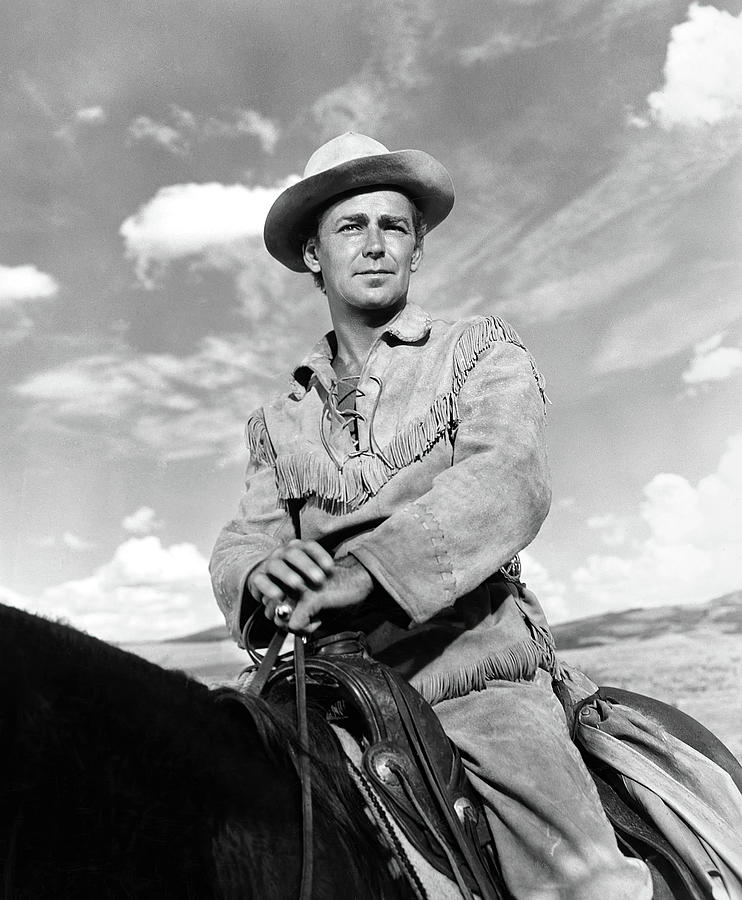 ALAN LADD in SHANE -1953-, directed by GEORGE STEVENS. Photograph by Album