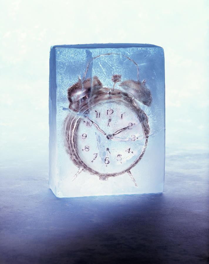 Alarm clock frozen in block of ice (Digital Composite) Photograph by Kelvin Murray