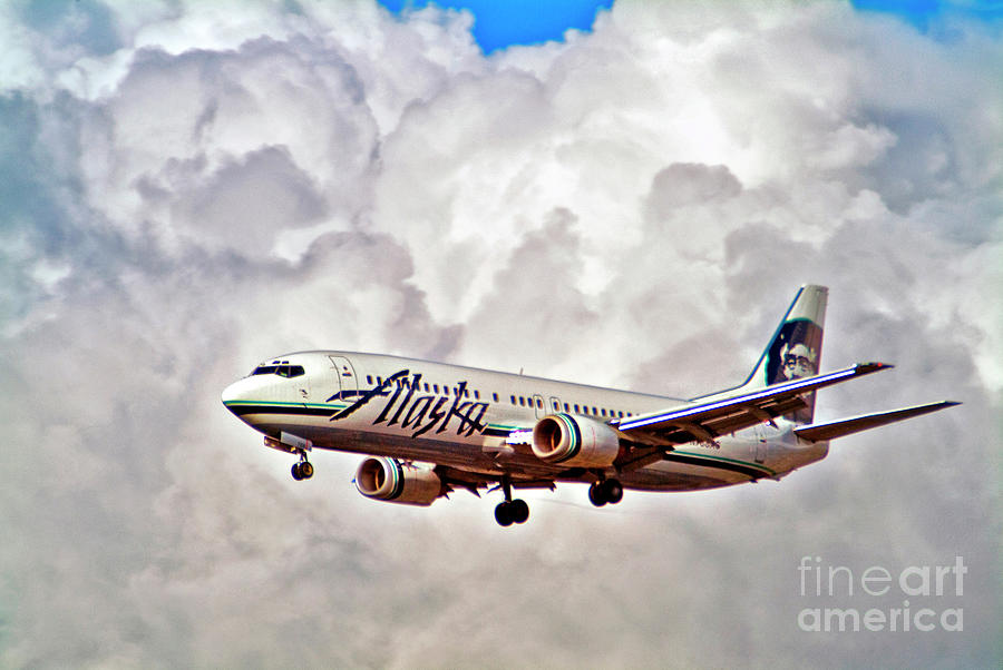 Alaska Airlines in Clouds Photograph by David Zanzinger