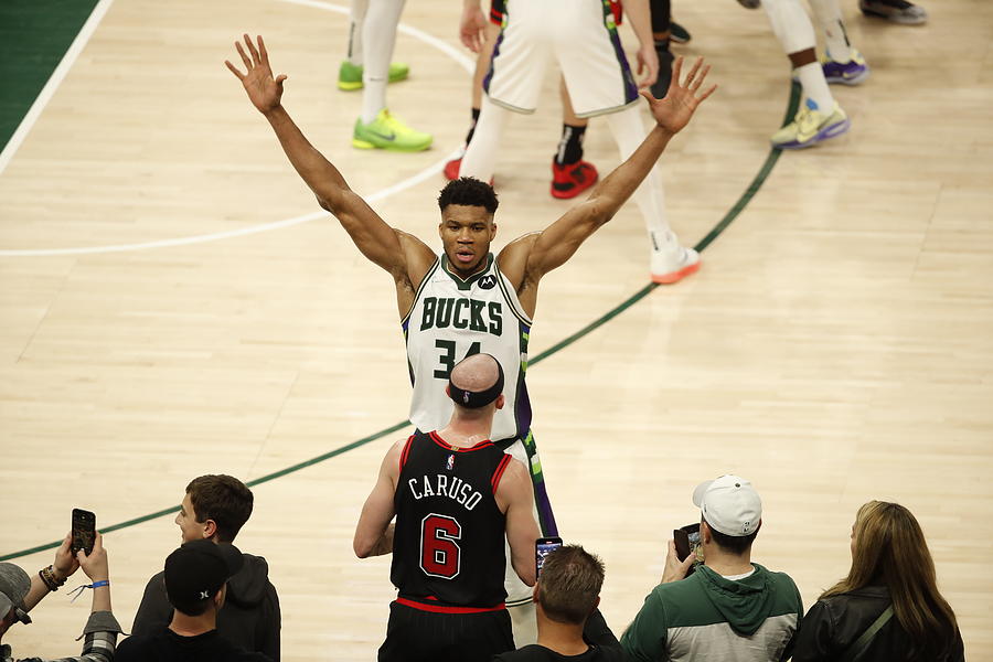Alex Caruso and Giannis Antetokounmpo Photograph by Jeff Haynes