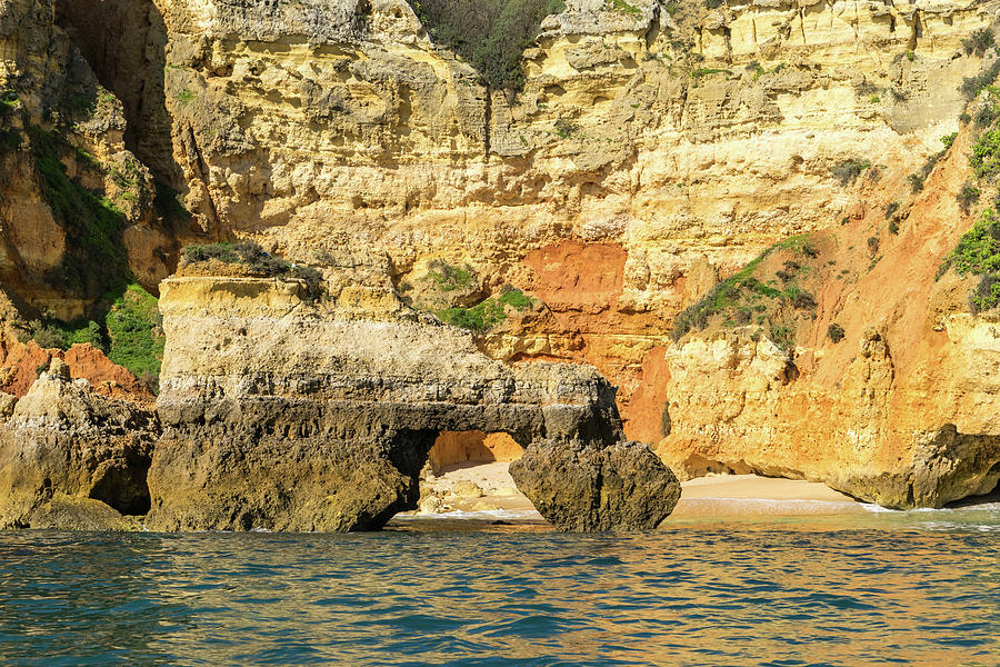 Algarve Gold Coast Sail - Bold Colored Seacliffs with a Natural Arch in Lagos Portugal Photograph by Georgia Mizuleva