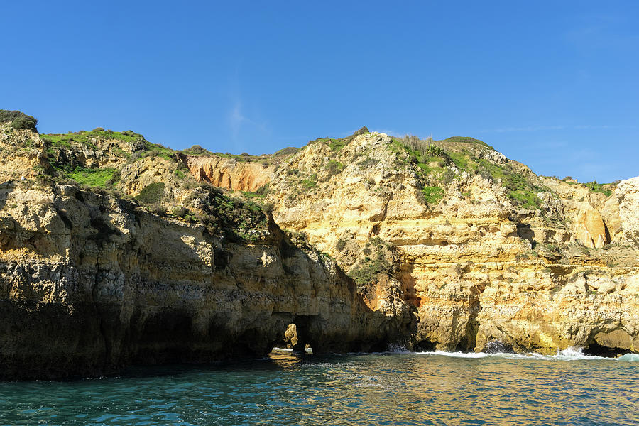 Algarve Gold Coast Sail - Bold Colored Seacliffs with Natural Arches in Lagos Portugal Photograph by Georgia Mizuleva