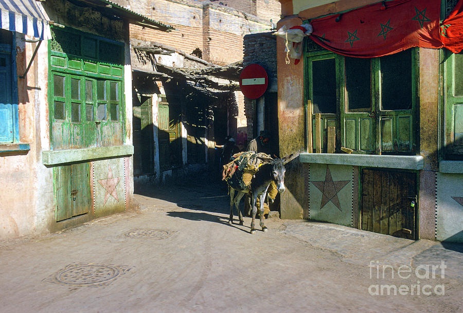 Alone in the Souk Photograph by Bob Phillips