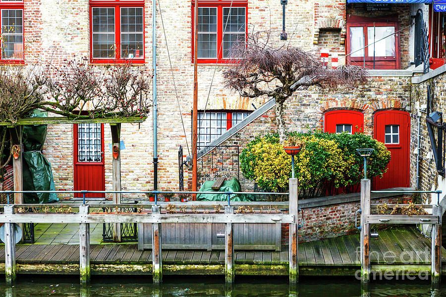 Along the Canal in Bruges Photograph by John Rizzuto