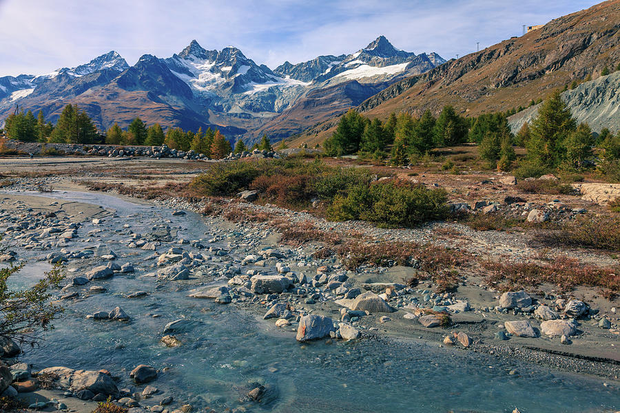 Alpine scenery with a stream Photograph by Alexey Stiop