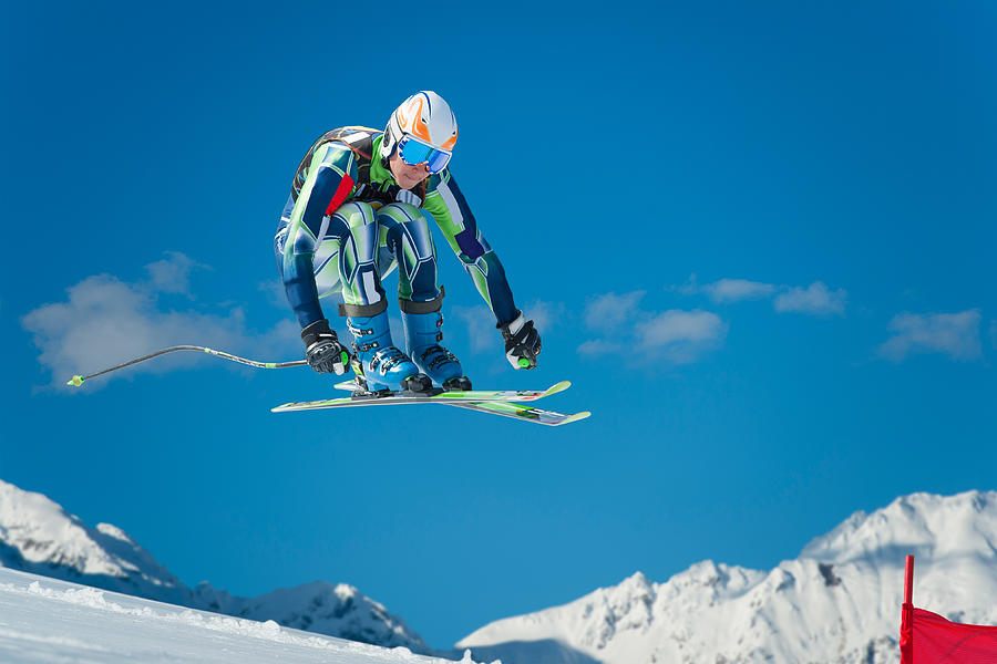 Alpine Skier Jumping During the Straight Downhill Race Photograph by Technotr