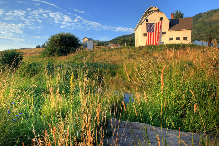 American farm with giant flag in field Photograph by Rhyman007