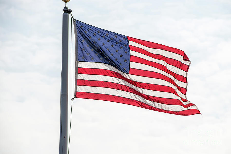 American Flag Against Sky Photograph by Susan Vineyard