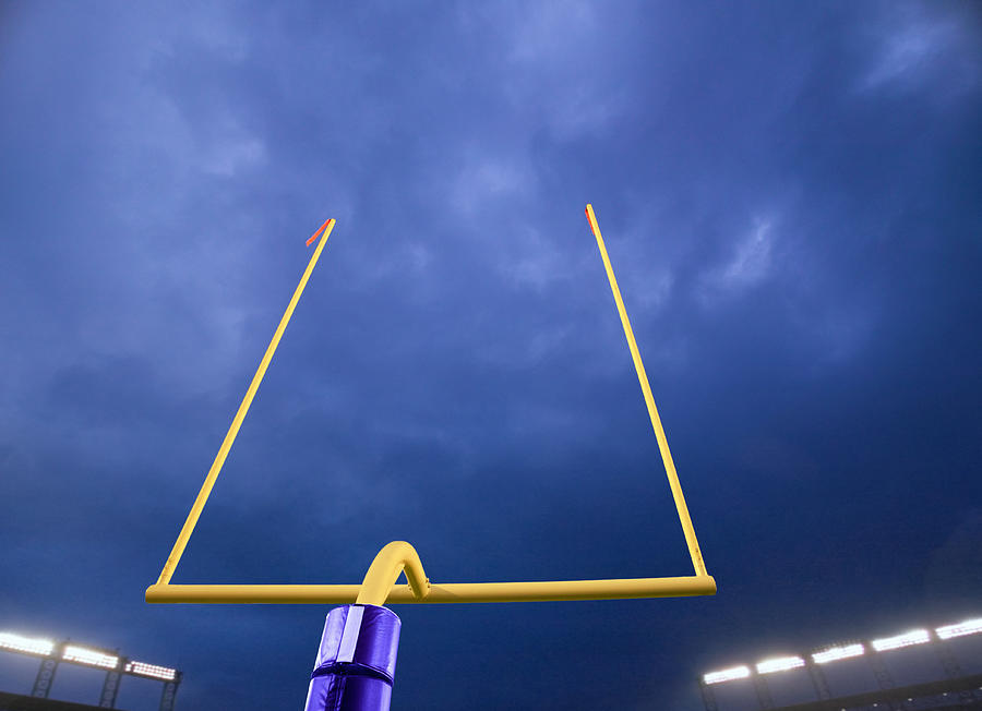 American football goalpost, night (Digital Composite) Photograph by David Madison