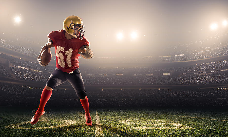 American football player in action Photograph by Aksonov