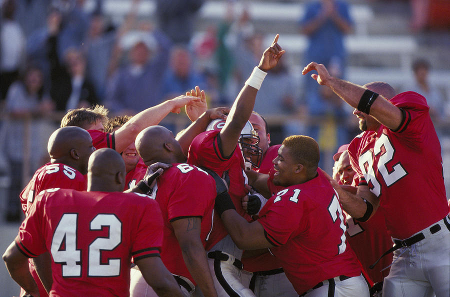 American Football team celebrating Photograph by Getty Images