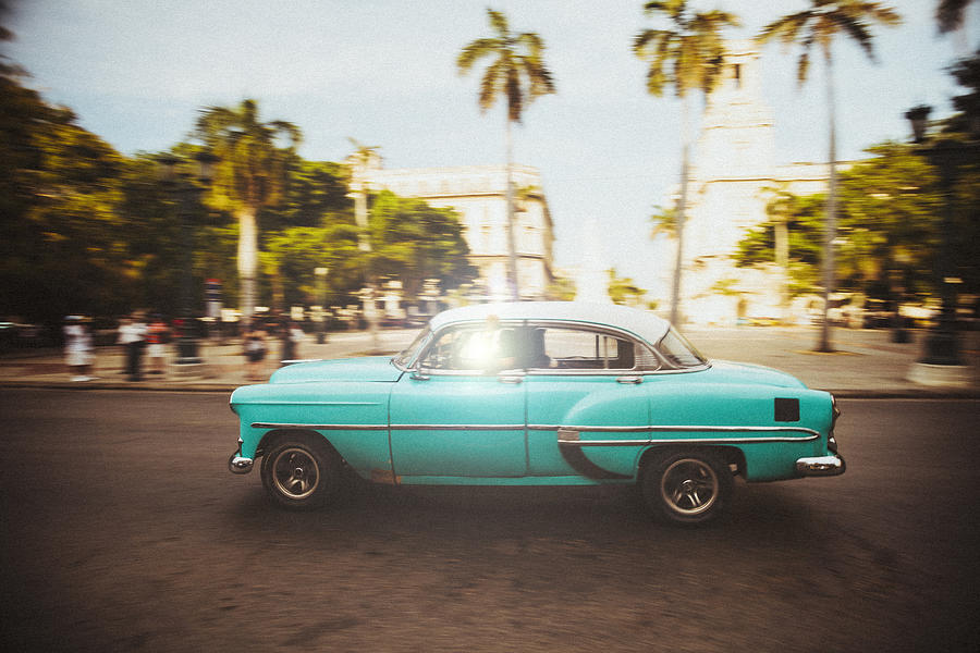 American oldtimer cruises the streets of Havana, Cuba Photograph by Travel_Motion