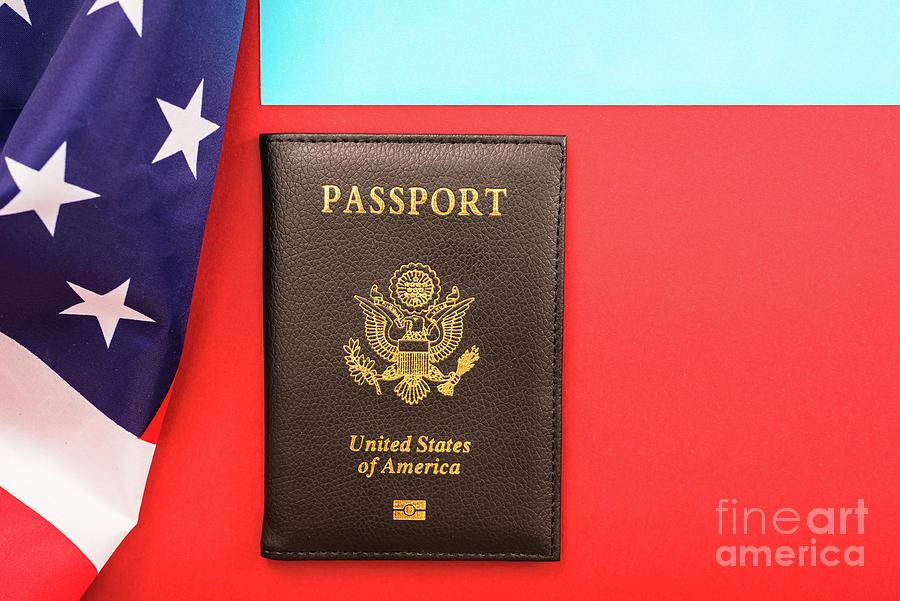 American passport on flag. Photograph by Joaquin Corbalan