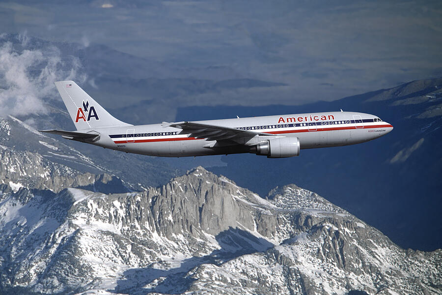 American Airlines Airbus A300 over Snowcapped Mountains Mixed Media by Erik Simonsen