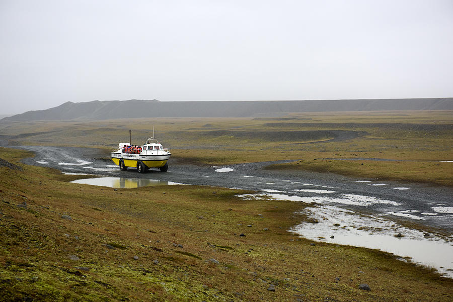 Amphibious vehicle and a group of tourists visiting Jokulsarlon lagoon, Eastern Iceland Photograph by Feifei Cui-Paoluzzo