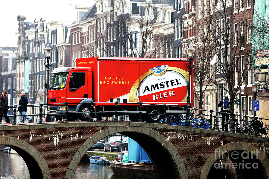 Amstel Bier Truck Over the Canal in Amsterdam Photograph by John Rizzuto