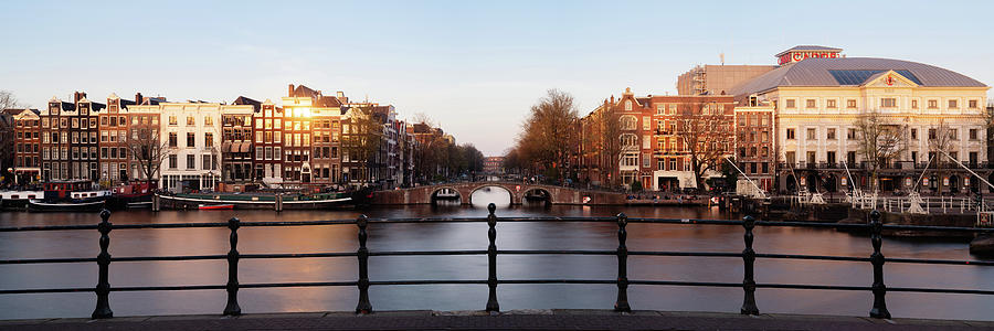 Amstel River and Architecture Amsterdam Netherlands Sunset Photograph by Sonny Ryse