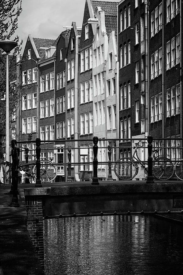 Amsterdam Canal Houses And Footbridge Photograph by Artur Bogacki