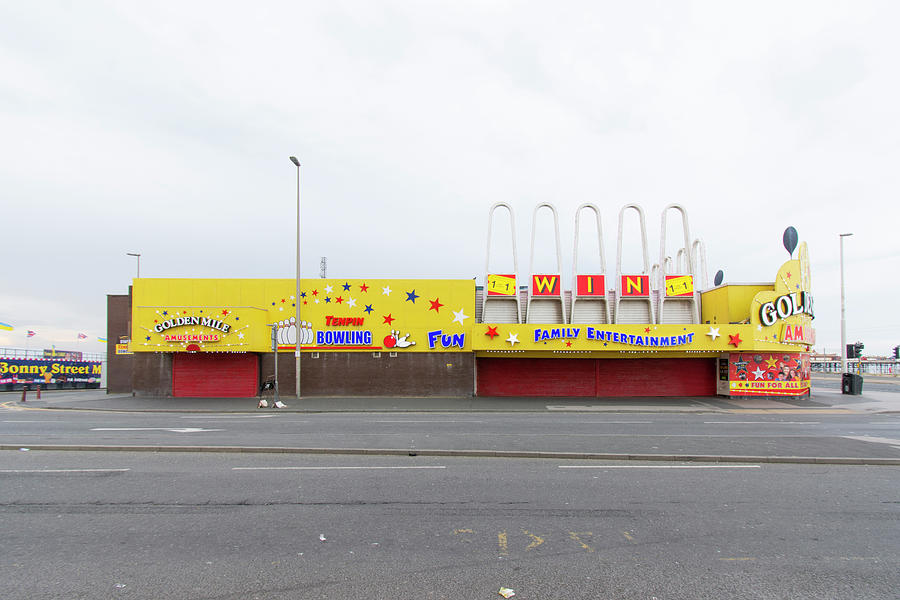 Amusement Arcade in Yellow Photograph by Stuart Allen