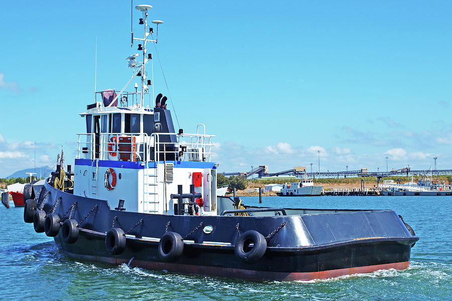 An 18 meter Commercial Tug Boat under way in Gladstone Marina Ha Photograph by Geoff Childs