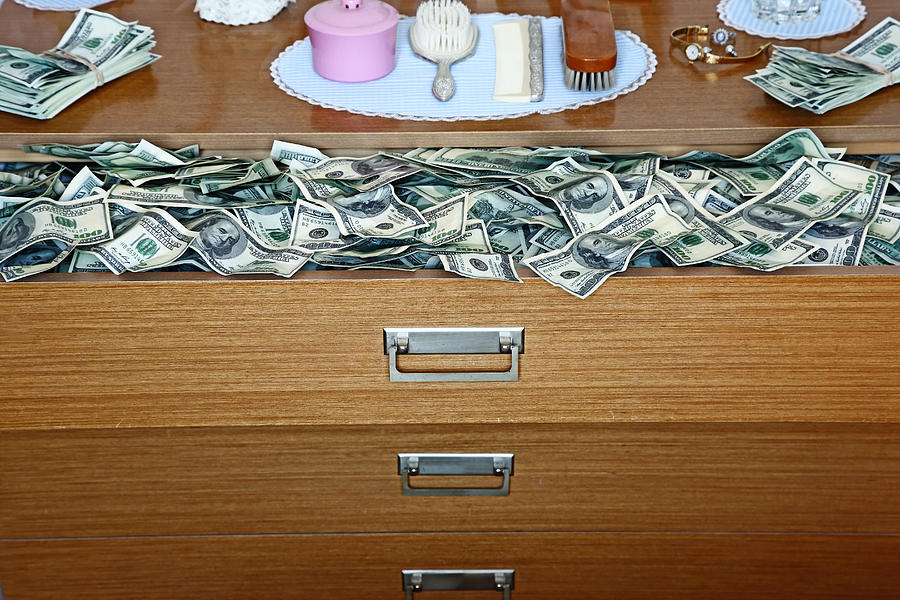An Abundance Of 100 Dollar Bills In Old Dresser Photograph by Martin Poole