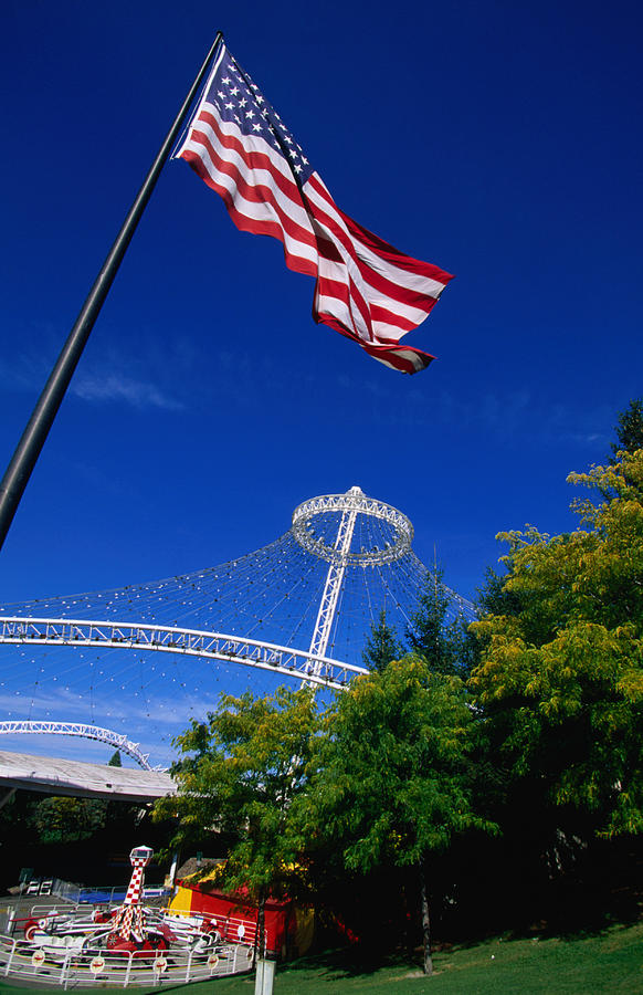 An American flag still flies at the US pavilion in Riverfront Park, home of the 1974 Worlds Fair. Photograph by John Elk