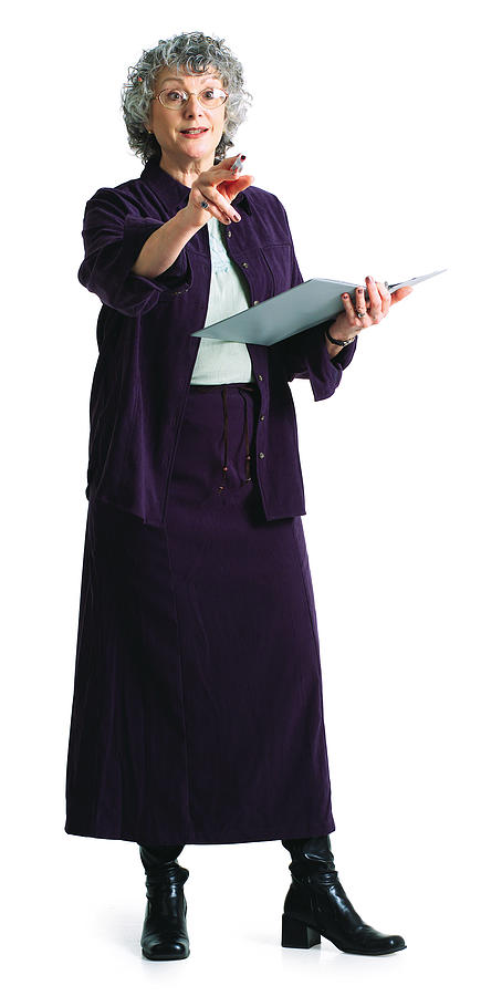 An Elderly Caucasian Female Instructor Teaches While Holding A Notebook Photograph by Photodisc