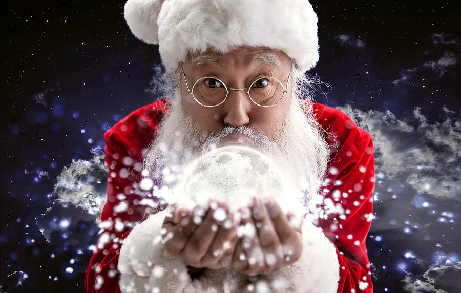 An elderly man dressed in a Santa suit Photograph by ViewStock