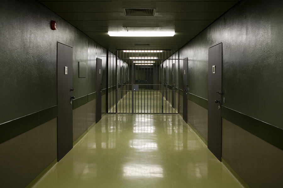 An empty prison corridor Photograph by Halfdark