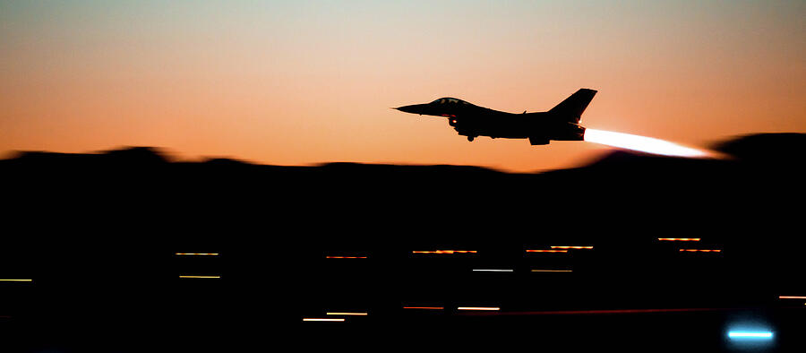 An F-16 Fighting Falcon assigned to the 309th Fighter Squadron takes off Photograph by Lawrence Christopher