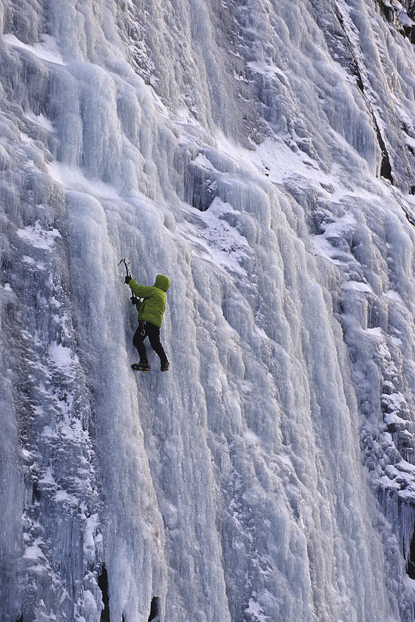 An ice climber boulders around at the ice at Winding Stair Gap on Hwy 64 near Franklin, NC Photograph by Harrison Shull