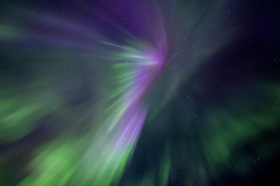 An intense aurora burst overhead in the dark skies Photograph by Rob ...