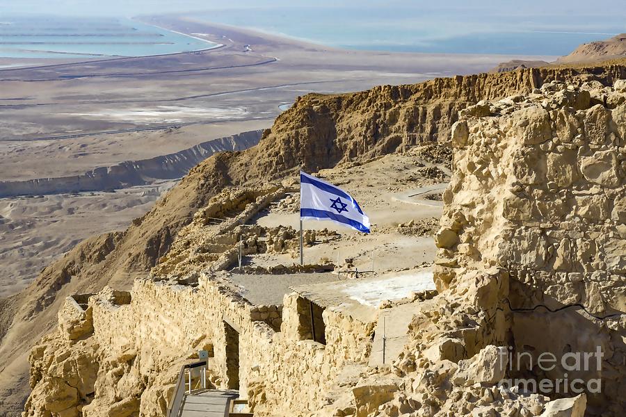 An Israeli flag flies near the entrance to the top of Masada in Masada National Park in Israel. Photograph by William Kuta
