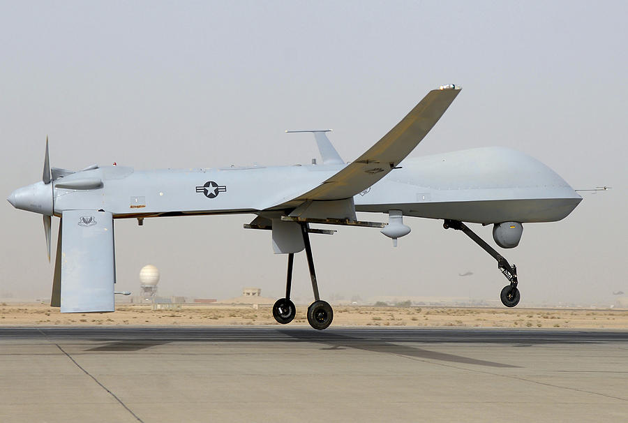 An MQ-1 Predator unmanned aircraft prepares for takeoff in support of operations in Southwest Asia. Photograph by Stocktrek Images