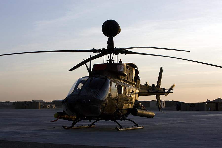 An OH-58D Kiowa during sunset. Photograph by Stocktrek Images