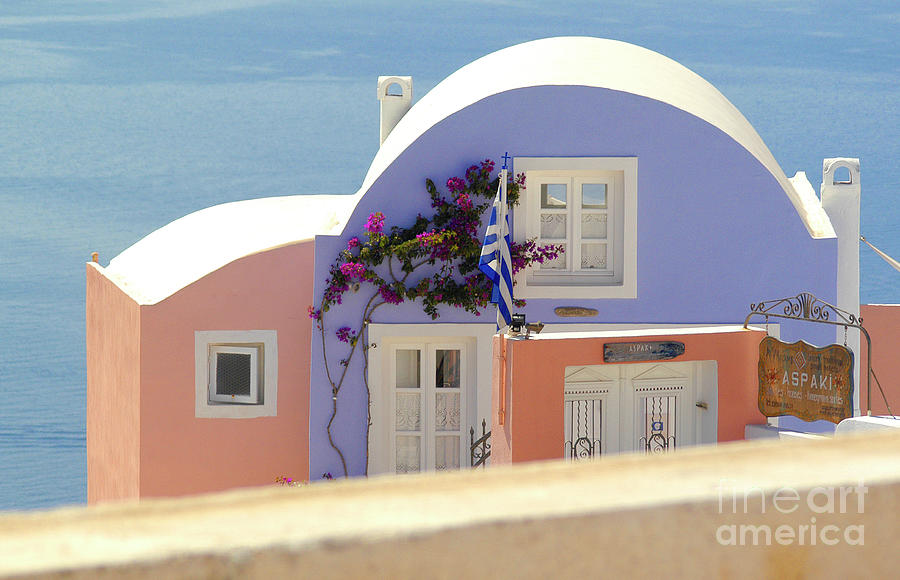 An Oia, Santorini guesthouse overlooking the beautiful ocean with unobstructed panoramic view.  Photograph by Gunther Allen