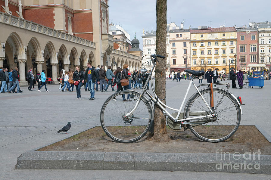 An Old Bicycle In Market Square Krakow Poland Photograph