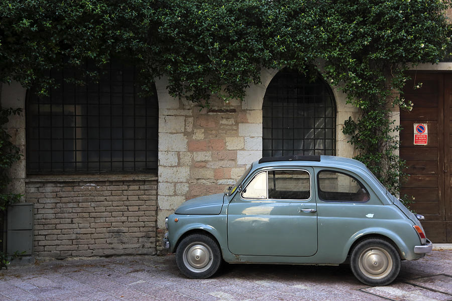 An old car parking on street of Assisi Photograph by Bruce Yuanyue Bi