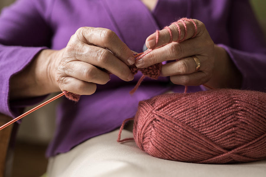 An old women knitting Photograph by StockPlanets